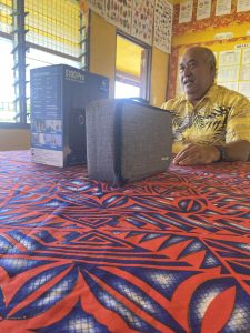 A volunteer delivers equipment to the school